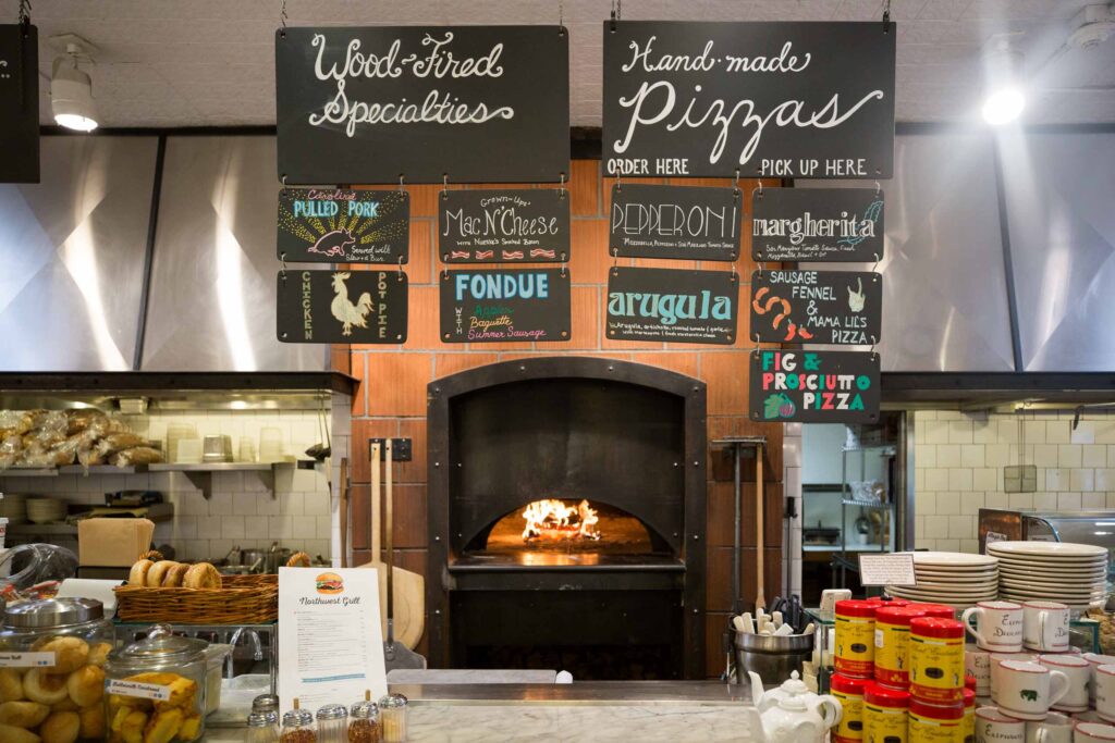 chalkboard signs and brick oven at Elephants Delicatessen at NW 22nd