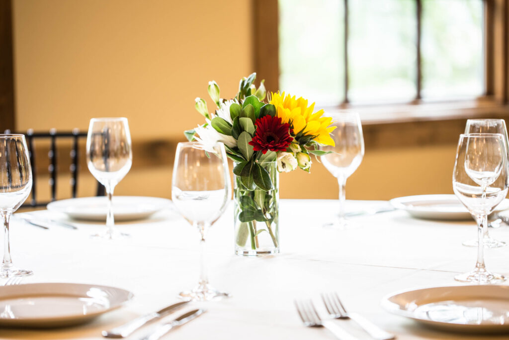 place settings with wine glasses at Elephants Delicatessen Corbett Room event space