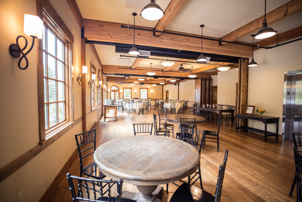 Elephants Delicatessen Corbett Room event space set up with wooden tables and wrought iron chairs