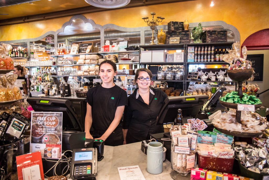 Employees at register at Elephants Delicatessen at Corbett