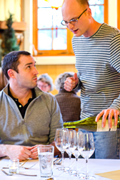 Elephants Delicatessen people pouring wine into glasses