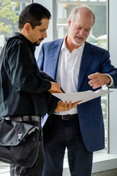 Store Manager Alfonso and Chef Scott looking at plans